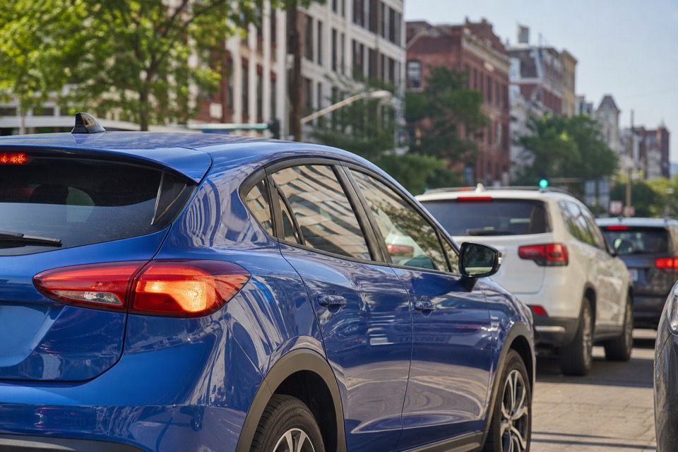 Compact car in everyday city traffic